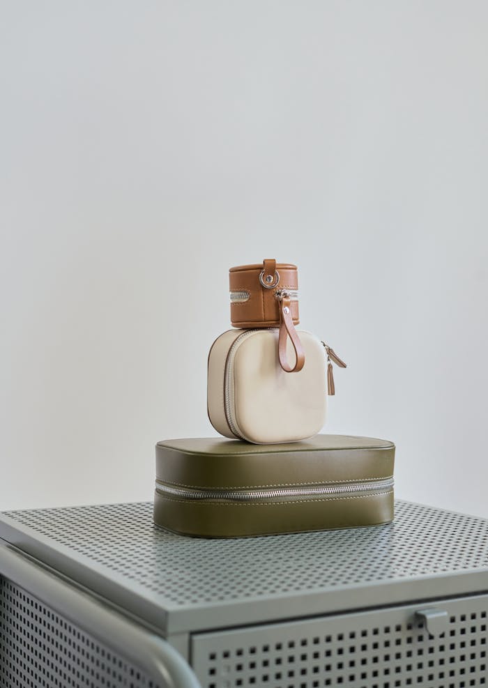 services-03 Assorted small handbags on a metal cabinet with a sleek, minimalist style.